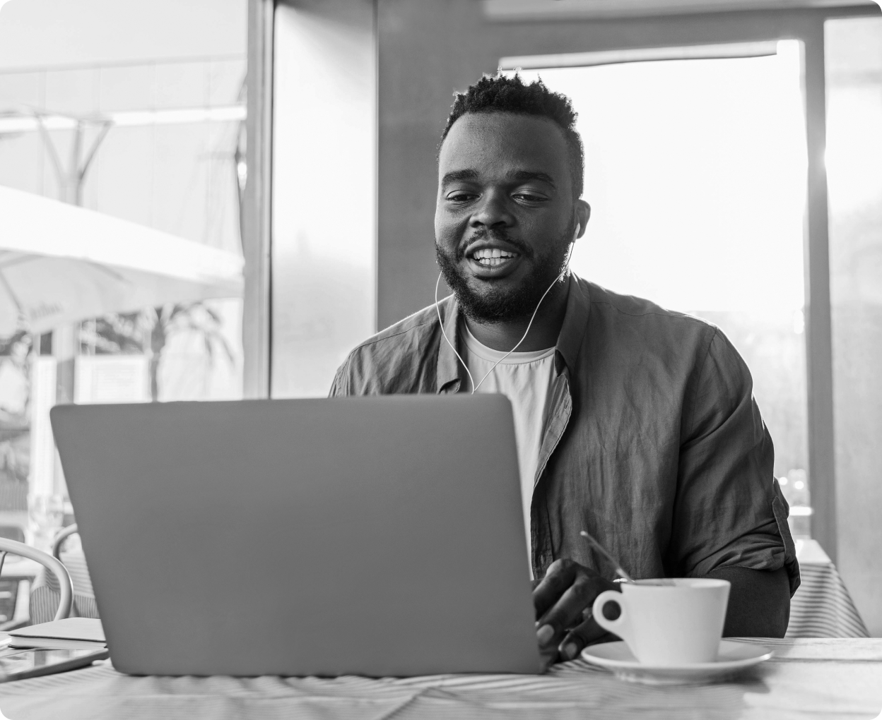Person smiling working on laptop